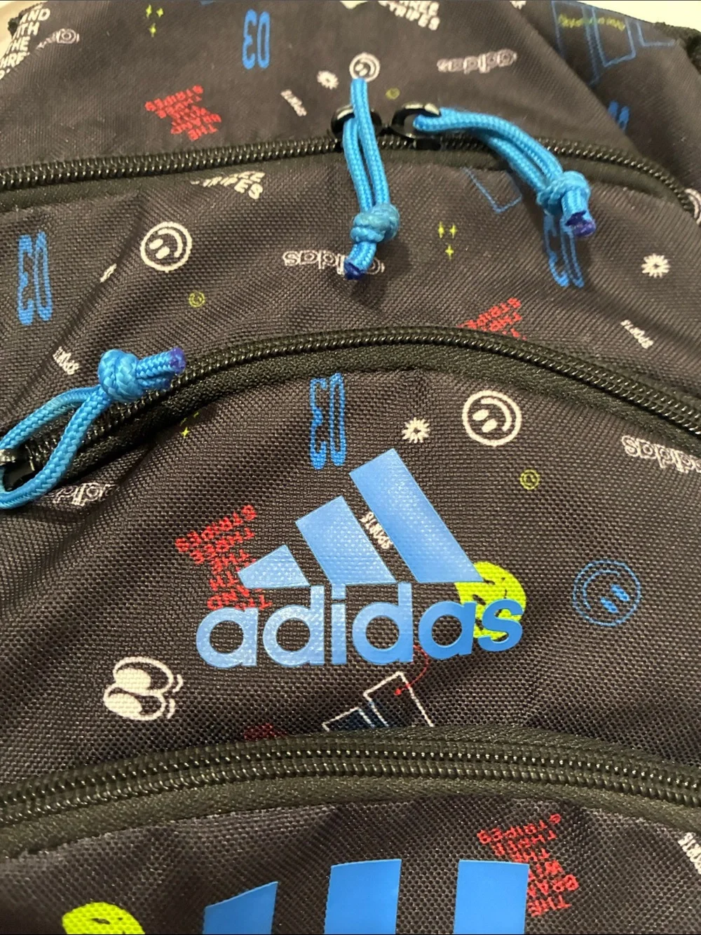 adidas Black Backpack with Bright Blue Stripes and Multicolor Accents
